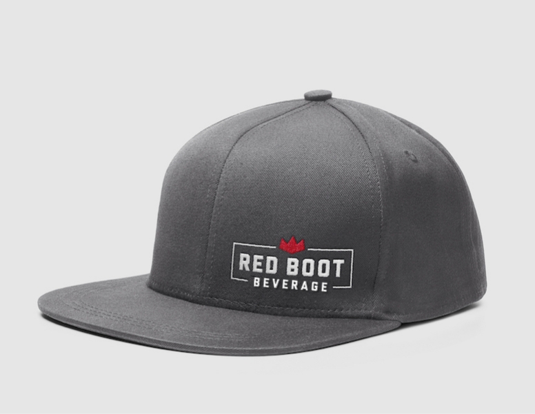 A dark gray hat with the Red Boot Beverage logo