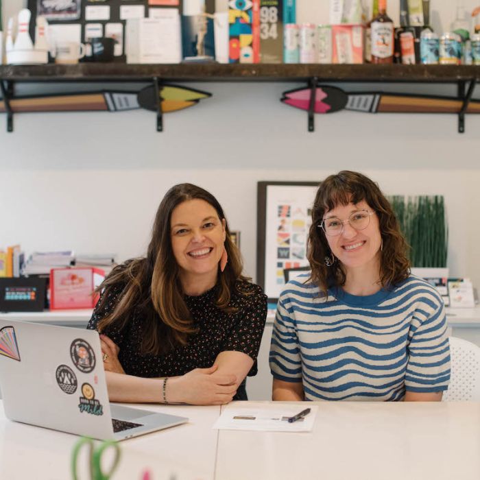 Kat Hutchison and Bridget Drendel sitting side by side in the in the p7 conference room