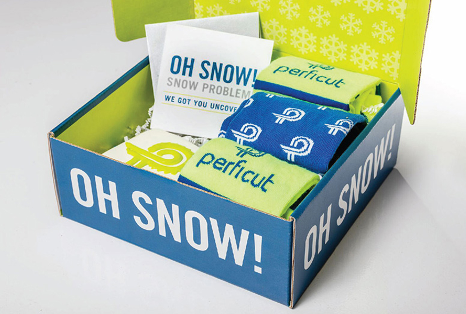 Perficut Oh Snow! sales box with sticker and branded socks