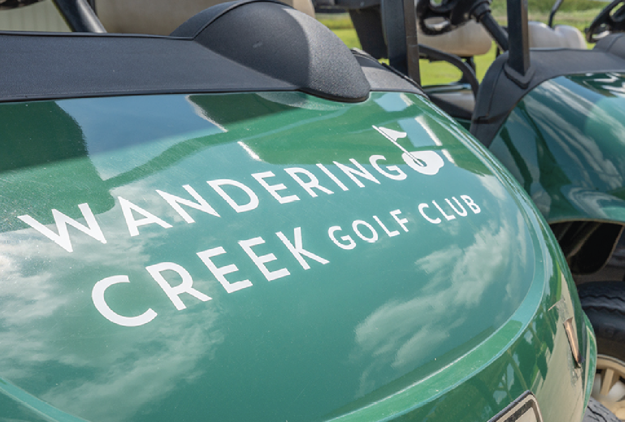 Wandering Creek logo on golf cart detail