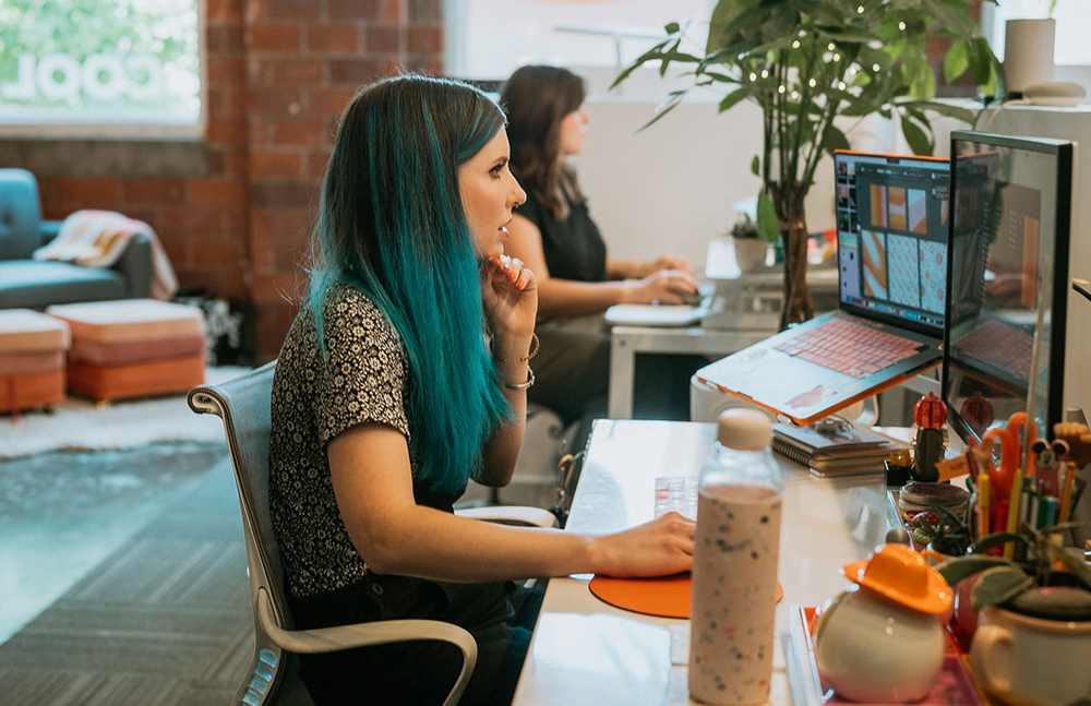 Jess working at her desk